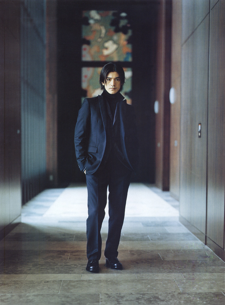Takeshi Kaneshiro In A black elegant suite with medium layered hairstyle